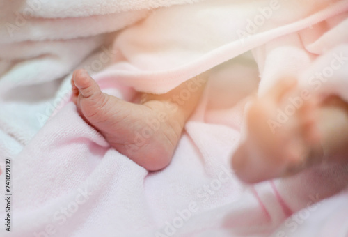 Baby feet / Newborn tiny baby feet soft selective focus