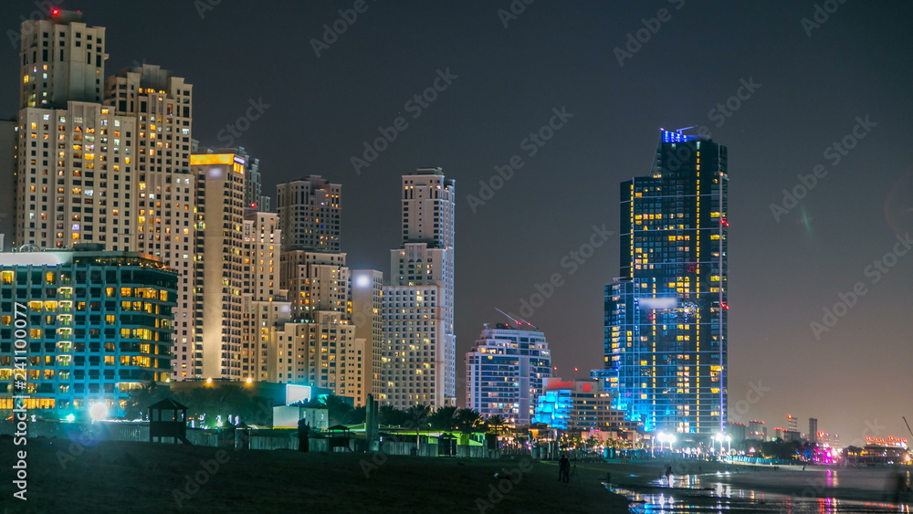 View of modern skyscrapers night timelapse in Jumeirah beach residence in Dubai, JBR
