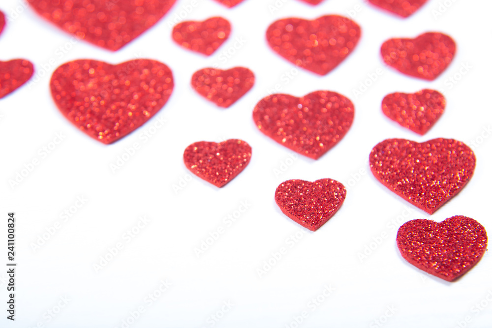 Valentine's Day, silver and red hearts on a white background with empty space