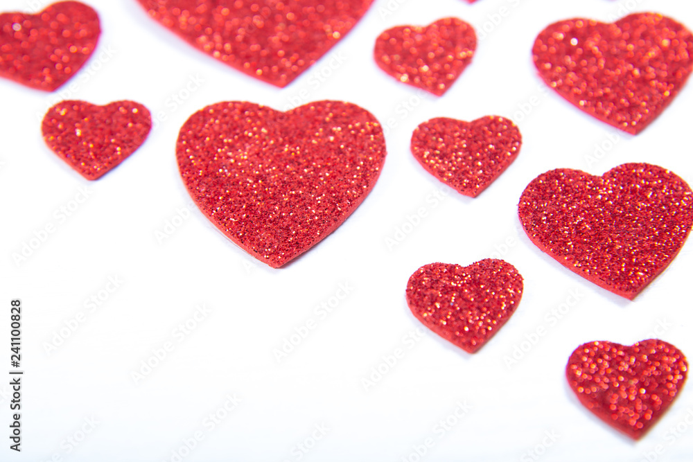 Fototapeta premium Valentine's Day, silver and red hearts on a white background with empty space