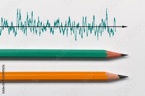 Two pencils and a graph photo