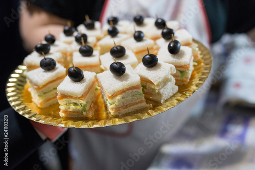 Wallpaper Mural horizontal image with vol-au-vent detail with pesto sauce and dried tomatoes, served on a tray and prepared for a party Torontodigital.ca