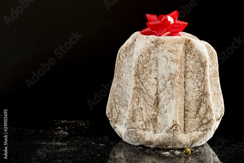 Wallpaper Mural horizontal image with close detail of a typical italian Christmas cake, the pandoro with a black background Torontodigital.ca