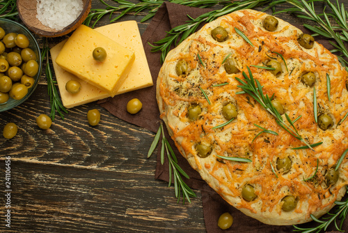 Traditional Italian focaccia with green olives and rosemary - homemade flat bread flatbread