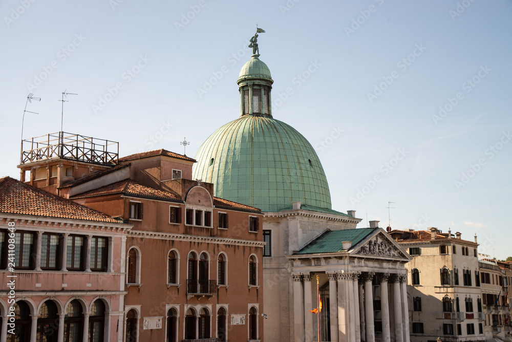 The Church of San Simeon Piccolo is located in the sestiere of Santa Croce, on the Grand Canal, Venice, Italy. Detail on the Venetian houses, the dome of the church and the faade.