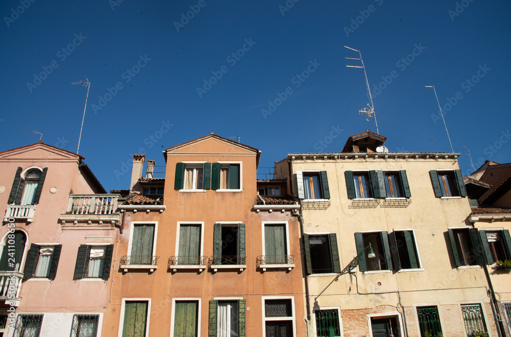 Facade of old houses, Venice, Italy. Detail on Venetian houses.