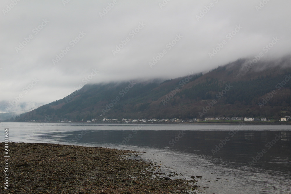 low cloud over mountain and loch