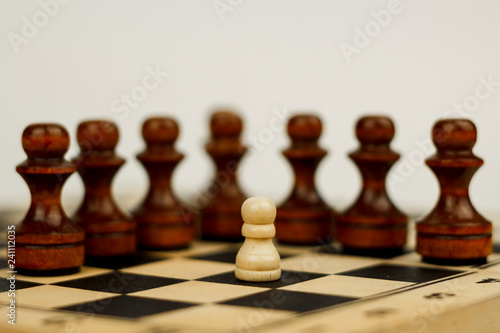 Wooden chess pieces on a chessboard