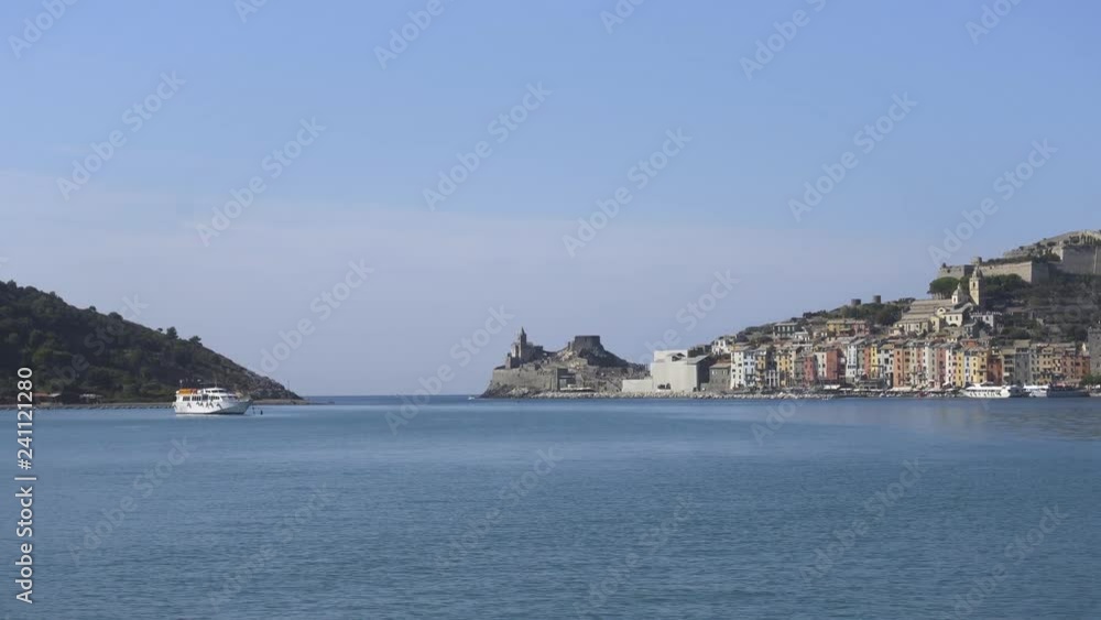 Boat sailing to one of Cinque Terre colorful towns - Portovenere, Italy, View from boat Colorful buildings, Beautiful sunny day Boat sailing to one of Cinque Terre colorful towns - Portovenere, Italy, View from boat Colorful buildings, Beautiful sunny day