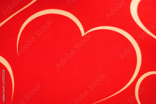 An abstract heart in white on a red background
