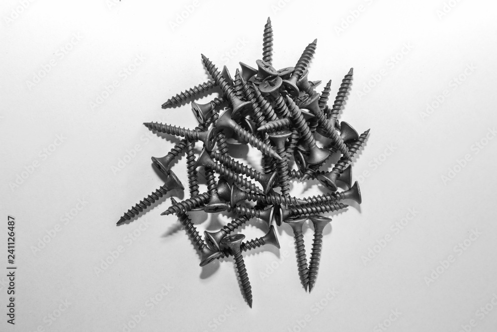 Black screws on a white background Black screws on a white background