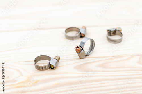natural background. metal clamp for car repair. shallow depth of field. there is toning