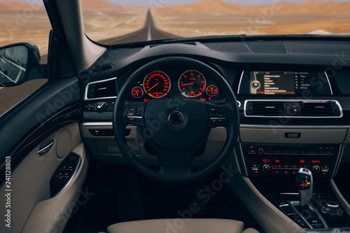 Modern car interior and dashboard in the desert
