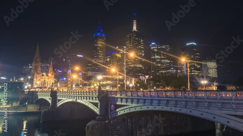 Timelapse of the Princes Bridge in Melbourne, Australia. Popular landmark for tourists with the old St Pauls cathedral in the background. photo