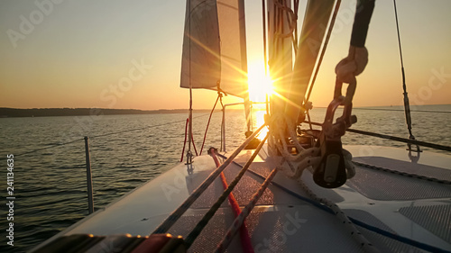 Fototapeta Naklejka Na Ścianę i Meble -  Beautiful sunset over sea, view from sailboat, luxury hobby, yachting vacation