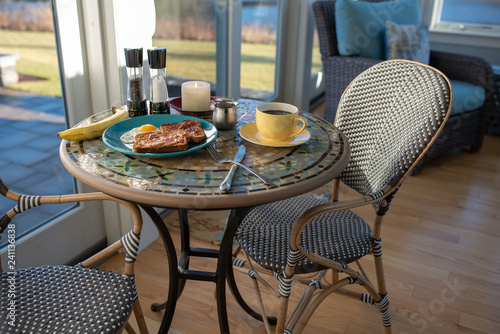 Breakfast meal with coffee, banana, beach plum jelly toast, and egg