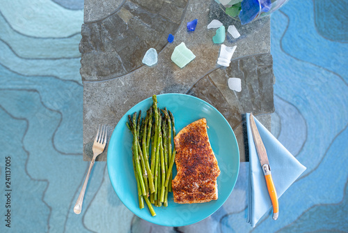 Keto lunch or dinner meal with seasoned cooked salmon, asparagus stalks