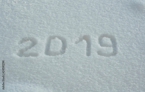 abstract winter New Year's and Christmas background from snow.text on snow 2019