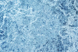 Abstract grunge dirty scratched concrete wall decorative winter blue color with frozen ice look background.