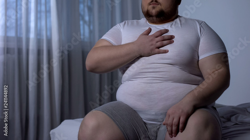 Obese male suffering from chest pain, high blood pressure, cholesterol level
