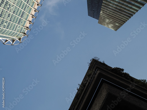 City of London, looking up at a blue sky with the points of three tall buildings
