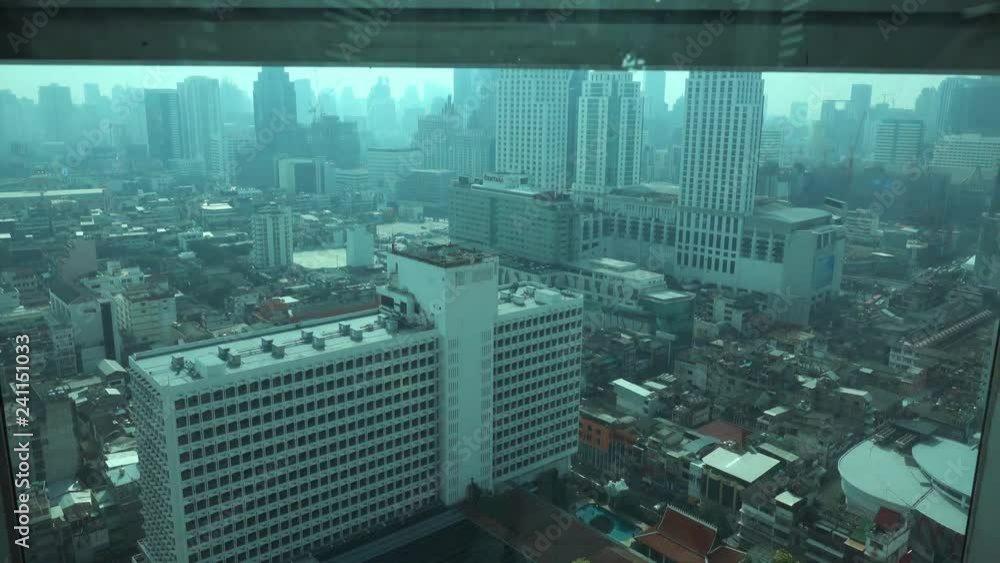 View on Bangkok city from moving up elevator in skyscraper, Thailand, 4k View on Bangkok city from moving up elevator in skyscraper, Thailand, 4k
