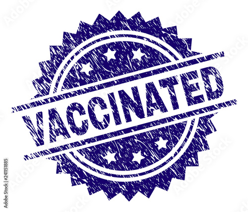 VACCINATED stamp seal watermark with distress style. Blue vector rubber print of VACCINATED label with dust texture.