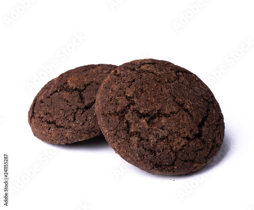 Two dark chocolate cookies on white background, isolated