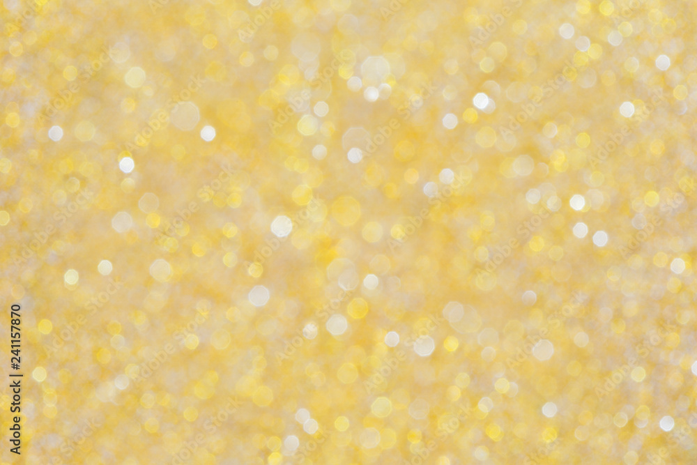 High resolution gold colored blurred bokeh background. Abstract full frame shiny glitter background for Christmas, New Year, holiday season and celebration. High resolution gold colored blurred bokeh background. Abstract full frame shiny glitter background for Christmas, New Year, holiday season and celebration.
