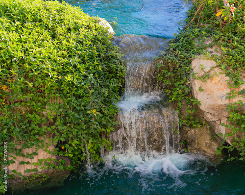 Waterfall with Greenery and Rocks
