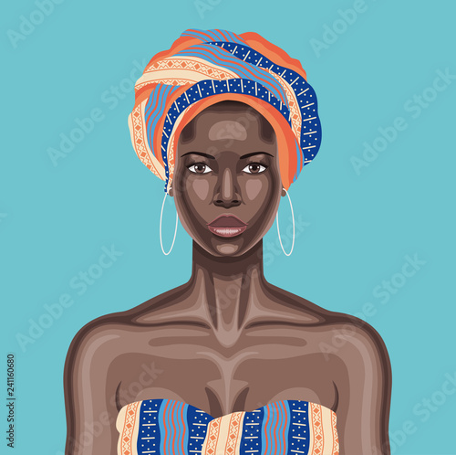 Young beautiful black woman with multicolor head wrap and white hoop earrings