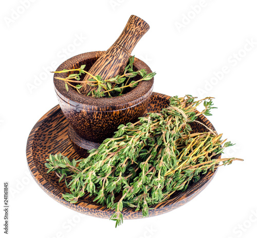Thyme sprigs, mortar, pestle, herb for cooking