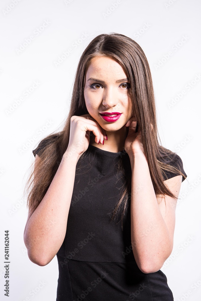 Beautiful young African American woman in black dress isolated over white background Beautiful young African American woman in black dress isolated over white background