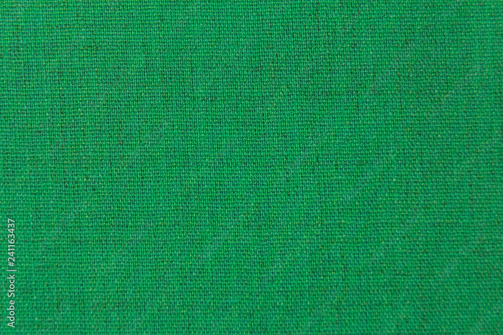 Fototapeta premium The structure is dark green fabric with a natural texture. Fabric background.