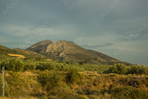 picturesque scenery of south European mountain landscape with big valley on foreground in evening romantic lighting  world travel concept