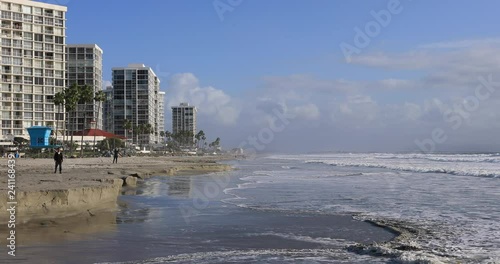 Beach sand erosion resorts Coronado Beach San Diego California. Near Historic beachfront hotel across bay from San Diego, California. Opened in 1888 as largest resort hotel in the world.  photo