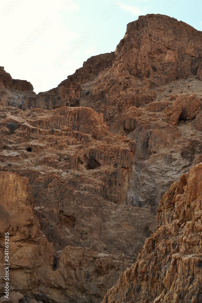 Qumran caves in Qumran National Park, where the dead sea scrolls were found, Judean desert hike, Israel