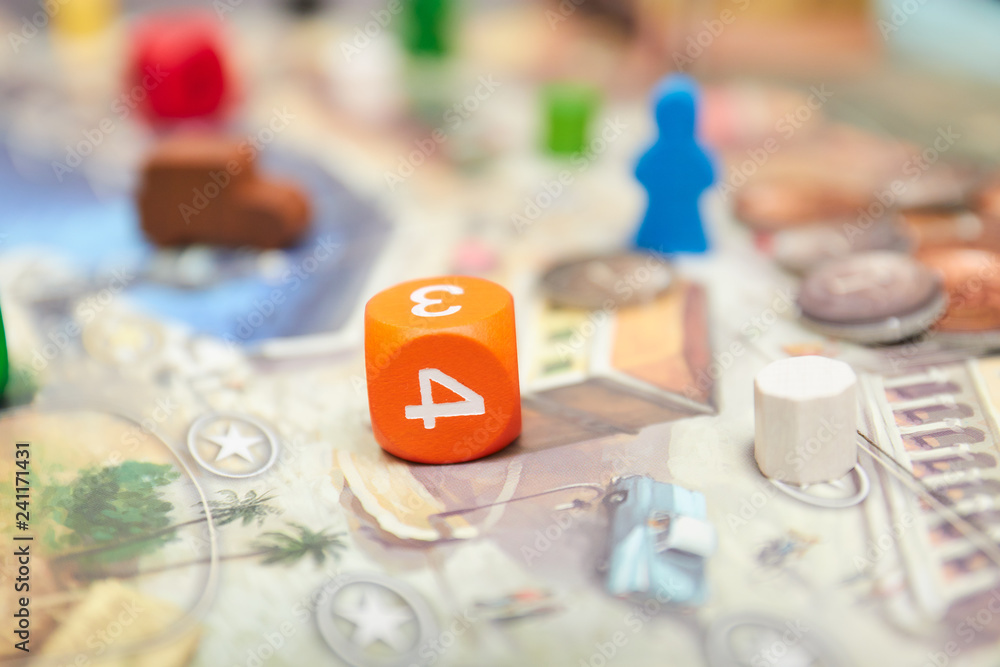 Cubes with the game on the table. themed Board games. vertical view of the Board game close-up. Cubes with the game on the table. themed Board games. vertical view of the Board game close-up.