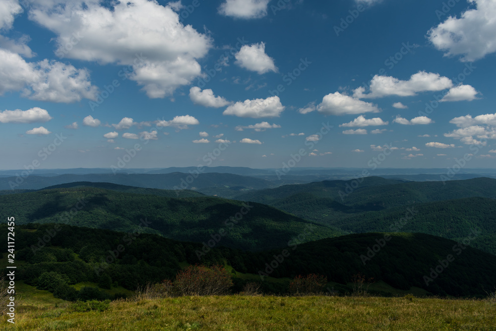 Naklejka premium landscape with mountains and clouds