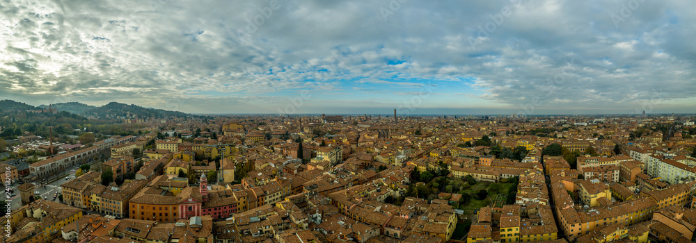Aerial panorama view of Bologna the capital city of Emilia Romagna province in Italy home to the best food and two leaning towers on a winter afternoon with sun set cloudy sky