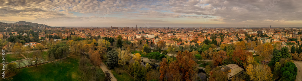 Fototapeta premium Aerial panorama view of Bologna the capital city of Emilia Romagna province in Italy home to the best food and two leaning towers on a winter afternoon with sun set cloudy sky