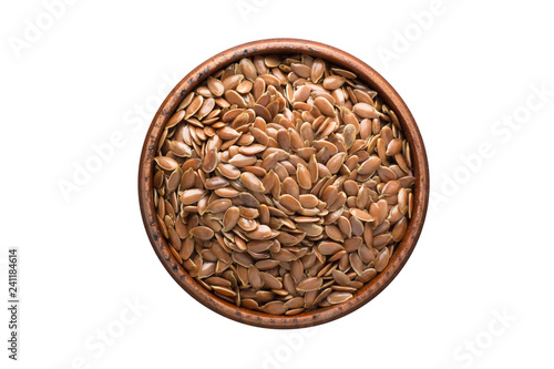 flax seeds spice in wooden bowl, isolated on white background. Seasoning top view photo