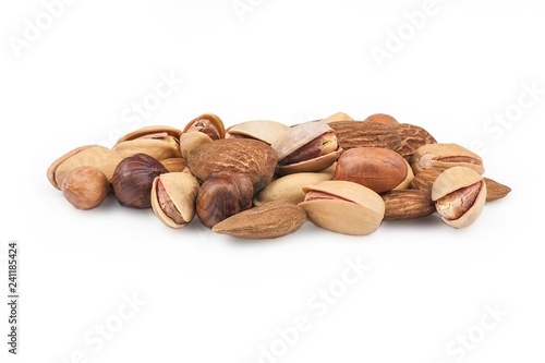 Nuts mix dried fruits isolated on white background, different kind of nut, healthy food on wooden table. hazelnut, pistachio, peanut, almond. Assorted nuts concept
