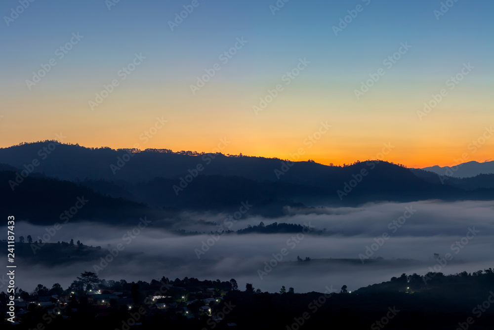 Mountain and foggy at morning time with orange sky, beautiful landscape in the thailand Mountain and foggy at morning time with orange sky, beautiful landscape in the thailand