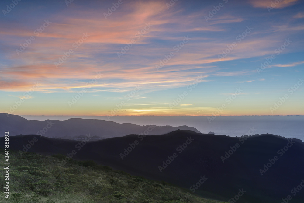 Sunset views of Sweeney Ridge top and the Pacific Ocean. Sweeney Ridge, Pacifica and San Bruno, San Mateo County, California, USA.