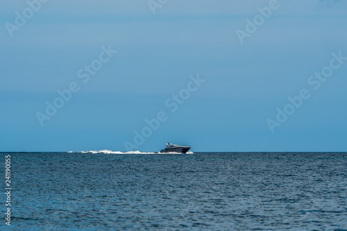 Coastal ocean waters with boats © oldmn