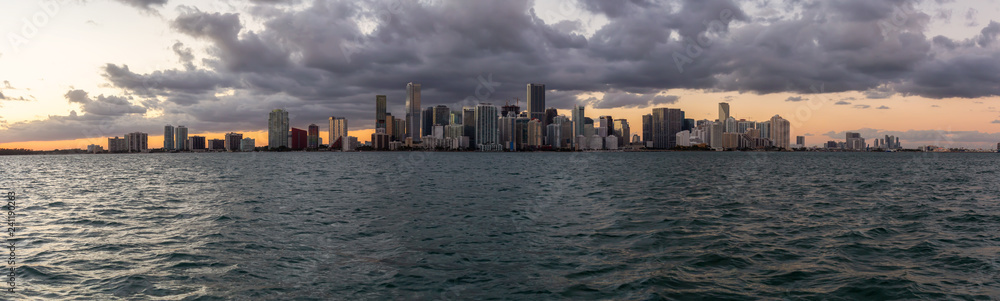 Beautiful panoramic view of a modern Downtown Cityscape during a dramatic and colorful sunset. Taken in Miami, Florida, United States of America.