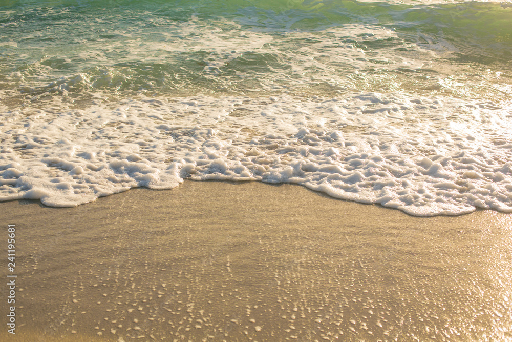 Soft Wave of Blue Ocean at sandy Beach. Background.