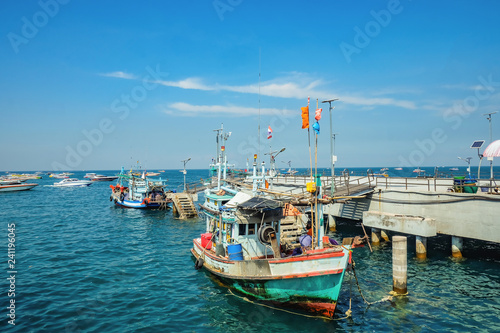 Beautiful view From Koh Lan island Pier with Fisherman Boat park near the pier.Thailand holiday concept