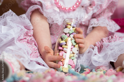 Girl Holding Jar of Candy Hearts